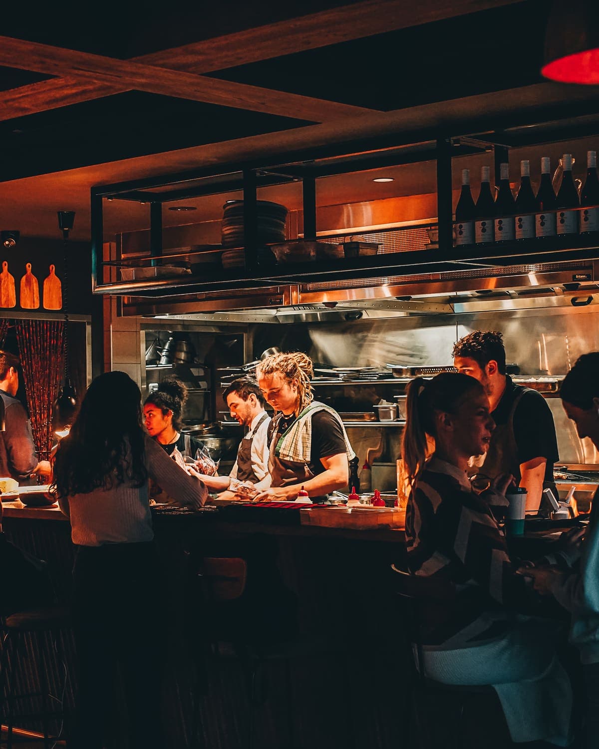 The Inn's bar mid-service, guests seated and the kitchen at work