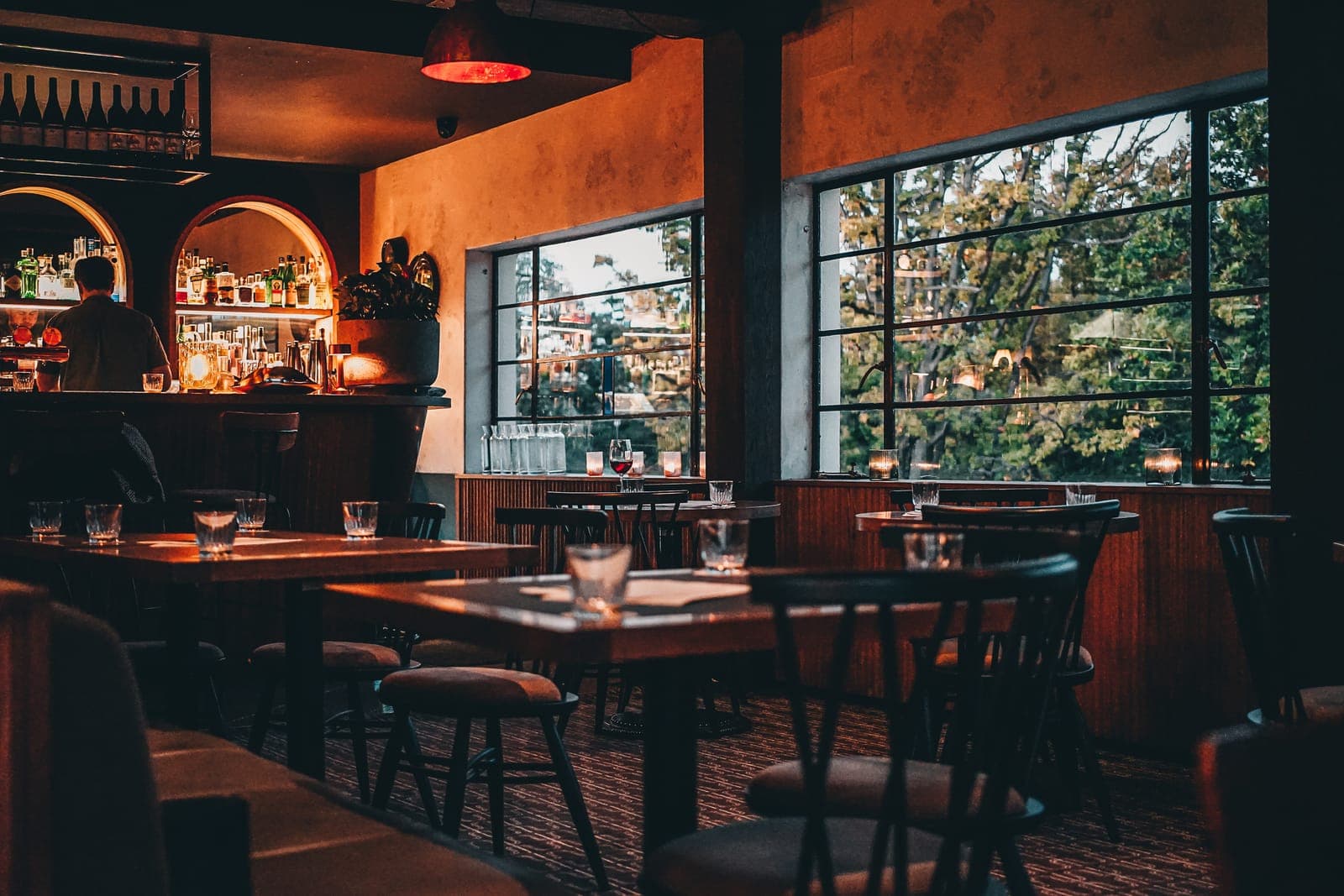 The Inn's dining room in daylight: timber tables and big windows